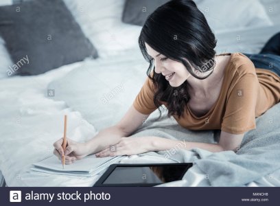 sitive-cheerful-woman-noting-down-her-ideas-MANCH8.jpg