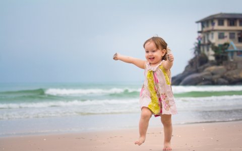 happy_girl_running_in_beach-wide.jpg