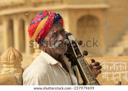 n-man-plays-an-indian-musical-instrument-237979699.jpg