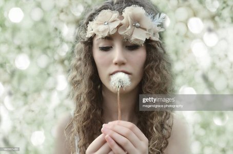 y-hair-holding-dandelion-clock-picture-id180352435.jpg