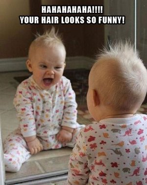 Funny-baby-looks-in-the-mirror.jpg