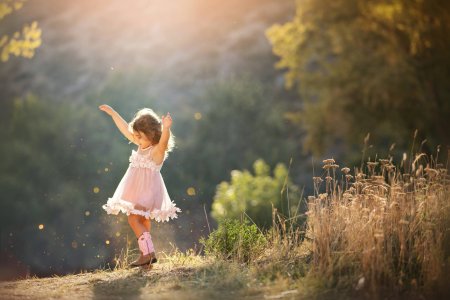little-girl-in-pink-tutu-dancing-in-back-light-at-sunset-with-sparkles-boulders-best-baby-and-...jpg