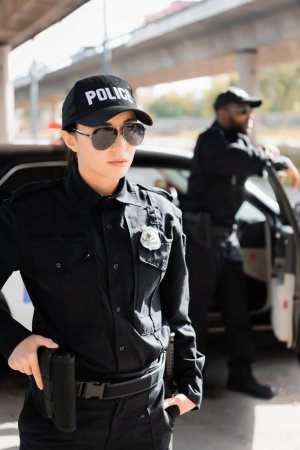 stock-photo-confident-policewoman-hand-gun-looking.jpeg