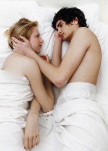 couple-in-bed-touching-face1-216x300.jpg